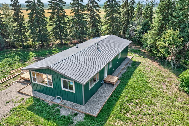 Aerial and exterior photograph of a residential property 6