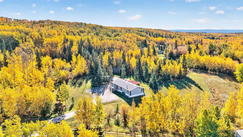 Aerial and exterior photograph of a residential property 7