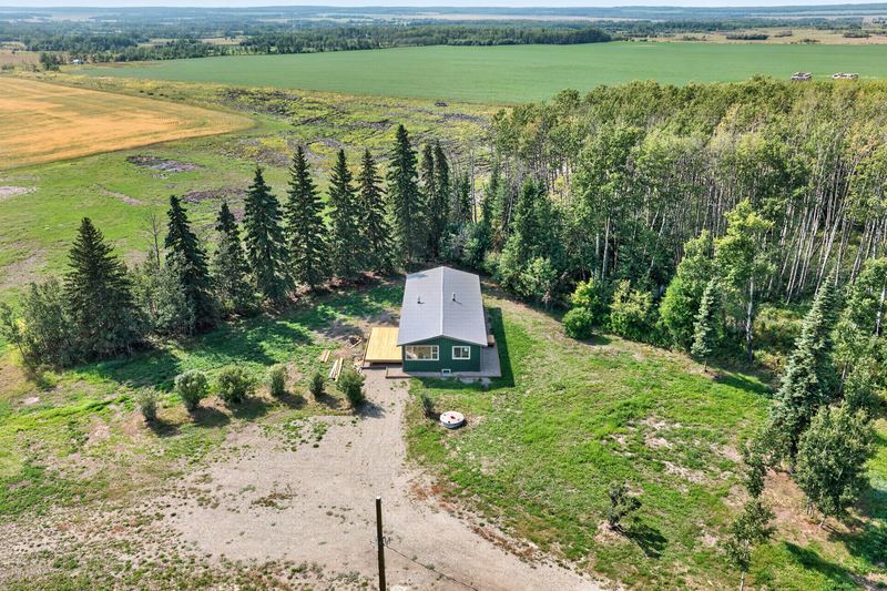 Aerial and exterior photograph of a residential property 10